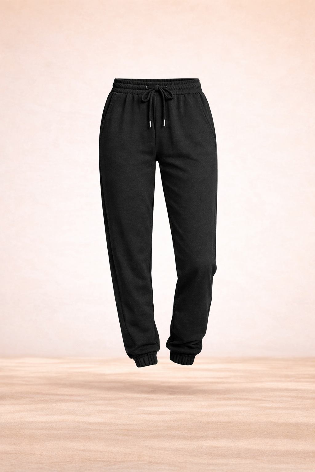 Women's Sweat Pants in black, featuring a drawstring and elastic cuffs, perfect for comfort and style.