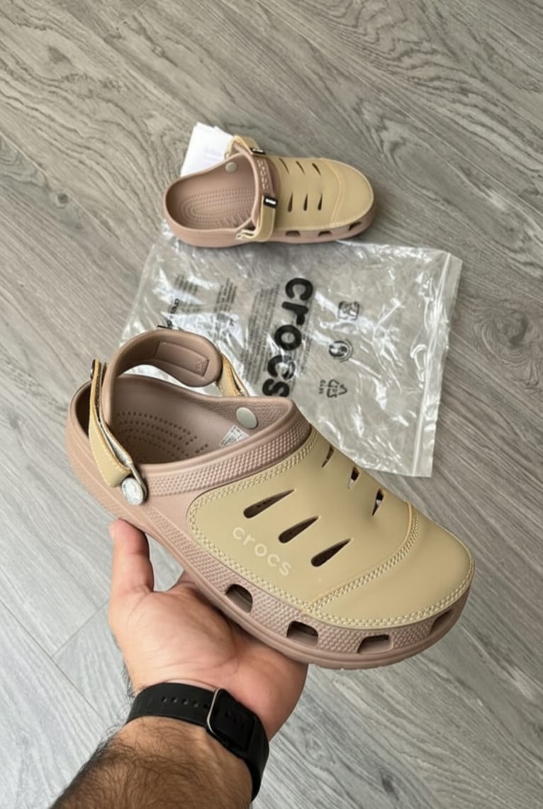 Crocs Yukon Sandals – Premium comfort footwear in brown-green with lightweight design, durability, and all-day wearability.